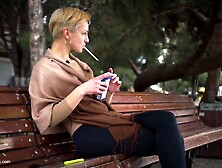 Short Cut Hair Blonde Girl Is Smoking All White 120Mm Cigarettes