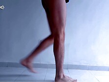 Lengthy legs and hot feet doing squats during the time that stripping