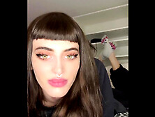 Attractive girl with a nose ring takes her socks off and reveals her sexy feet