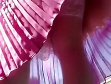 Whorish Chick In Pleated Pink Skirt Poses On Camera