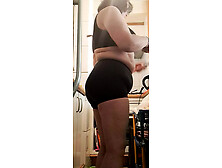 stepmother in big panties in the kitchen,  with hot movements