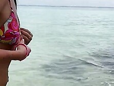 Sex on a public beach - a baby bathes in the ocean in sperm