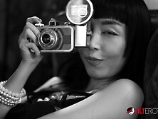 Darenzia Teases in a Black Latex Corset - AltErotic