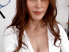 MILF coach Justine Jakobs shoves her tits as she massages her athlete