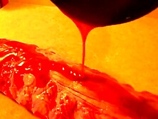 Rubbing the pig like he is a piece of meat