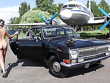 Soviet plane, black Volga and nude model