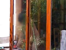 Neighbour cleaning windows.