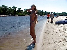 Watch A Naked Chick At The Beach Tan Her Hot Body