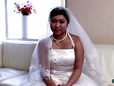 The recent Oriental bride remains attired in her bridal gown through a visitor's arrival