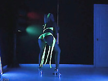 Alluring Babe Displays Her Smoking Hot Body In Neon Green Bikini As It Glows While She Dances In The Dark On A Pole Before She S