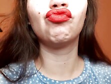 Natural lips with red lipstick smokin' a cigarette in close up