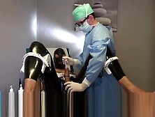 Doctor Fists And Sounds Latex Slave With Gloves In Gyno Chair