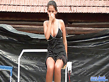 Black-Haired Dunk Tank Wetlook In Dark-Hued Dress