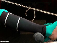 Black serf in green tights Nikki Darling with toes bound to teats gets feet caned then fastened in device on knees butt screwed
