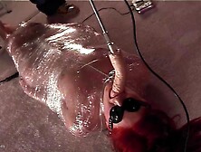 Redhead submissive MILF babe is wrapped in foil and face fucked