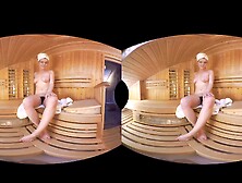 Brunette Wrapped In A Towel Showing Pussy In Sauna