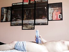 Lying on a daybed screwing a turbo ignition Fleshlight sideways perspective