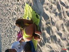 ASTOUNDING GREEK.  YELLOW BIKINI AT THE BEACH TEASING US