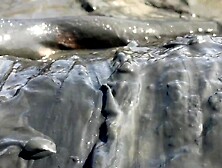 Hawt Angel playing in the River Mud.  Slimy joy (Fully Dressed)