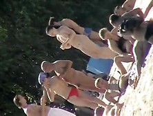 Uninhibited Beachgoers Let It All Hang Out On A Sunny Day A