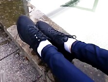 Girl wearing Nike sneakers enters mini-pool