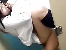 She straddles the man sitting on the toilet,  puts her hips on him,  and cums on his face.