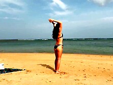 Skinny hotty walks along the beach and swims in the sea.  meet me