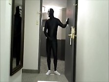 Skeleton Faced White Socked Black Morphman In Front Of Hotel Roo