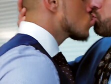 Men in suits enjoy a rough session of steamy sex at work