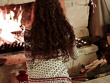 Setting Up The Fireplace: Curly Babe In A Winter Hoodie Warms Her Heart With Her Bare Hands