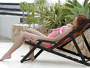 Young redhead teen Michelle posing