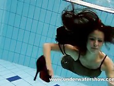 Brunette Kristy Stripping Underwater