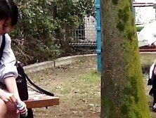 Three Japanese schoolgirls peeing in the same bag at once