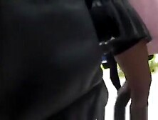 Upskirt on rolling escalators at shopping