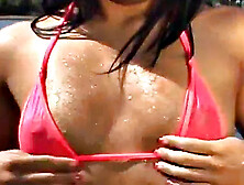 Gorgeous petite teen teases at the beach