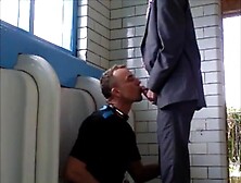 Young man sucks an old mens cock in the public toilet