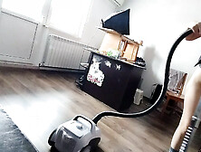 A female amateur cleans the house naked,  vacuums.
