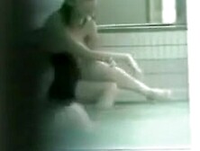 Cute Asian girlfriends relaxing naked in the pool