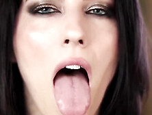 Nymph with dark hair and exotic make-up showcases off her tongue abilities for those with a hatch fetish