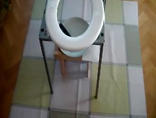 Sexy Babe Shitting On A Home Made Toilet