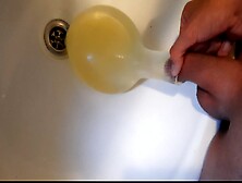 Young German Twink Pissing In Condom Till Its Completely Full An