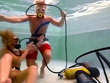 Seductive babes having fun with a guy in the pool