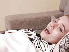 Sexy tattooed girl Angelina Bong rubs her pussy to orgasm on the couch.