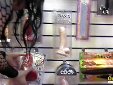 A visit to a sex shop by two busty lesbians