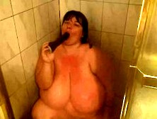 Busty Bbw Lexxxi Sucks Big Black Dildo In Shower