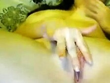 Brunette slut licks her own boobs