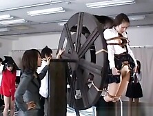 Japanese Schoolgirls Punished On Waterwheel