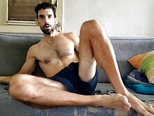 Bare model masturbating on the sofa