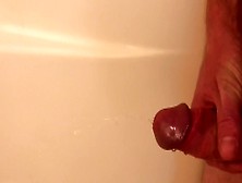 Guy Pisses In The Tub,  Then Jerks Himself Off Until He Cums