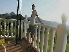 Super Cute Girl Toying On The Terrace